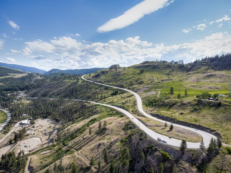 Winding highway through rolling green hills in Boundary Country